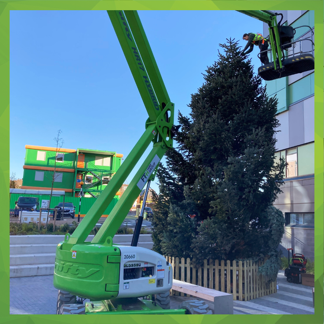 HR17 Boom Lift Successfully Installing Lights on 30ft Christmas Tree in Southampton